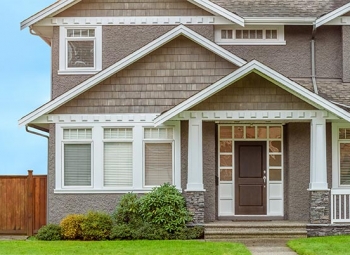 Roofing Project for a brown color house with a garden in Gresham, OR
